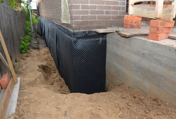 SJ Waterproofing Pros technician performing targeted Basement Waterproofing assessment in Fairview, NJ